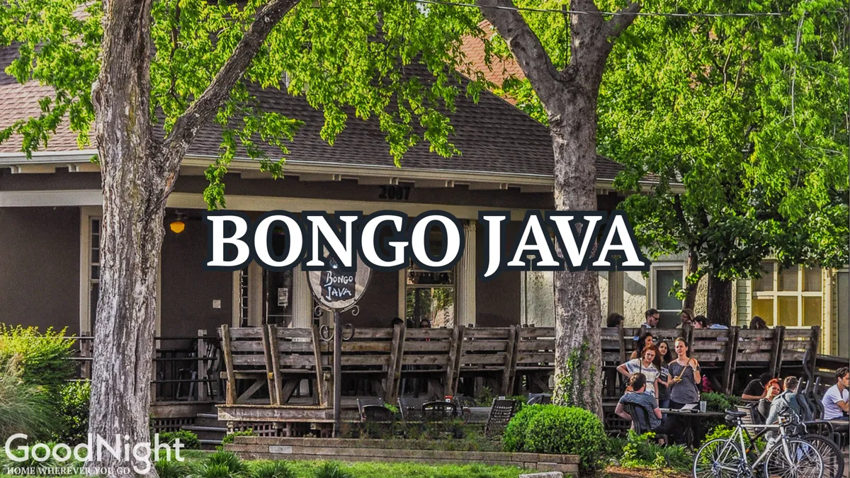 This image features the exterior of Bongo Java, a well-known local coffee shop. The scene captures the cafe's inviting signage, outdoor seating area, and people socializing, set against the backdrop of Nashville's vibrant streetscape.